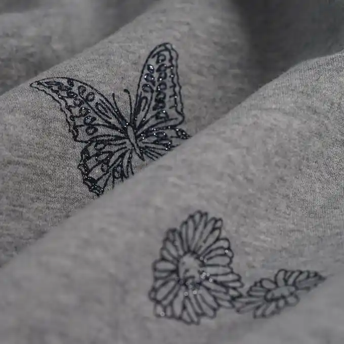 Sweatshirtstoff Schmetterlinge grau Preisknaller