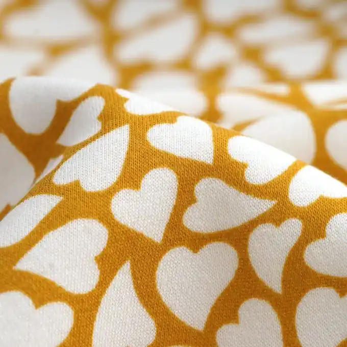 Saisonangebot Sweatshirtstoff Herzen senfgelb