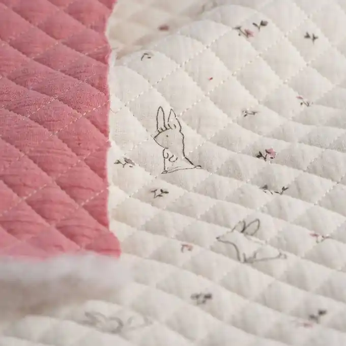 Großhandel Musselin-Steppstoff Hasen weiß und pink