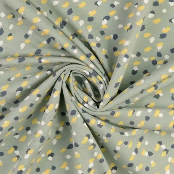 Jetzt Bestellen Bio-bedruckter French-Terry mit abstrakten grünen Punkten