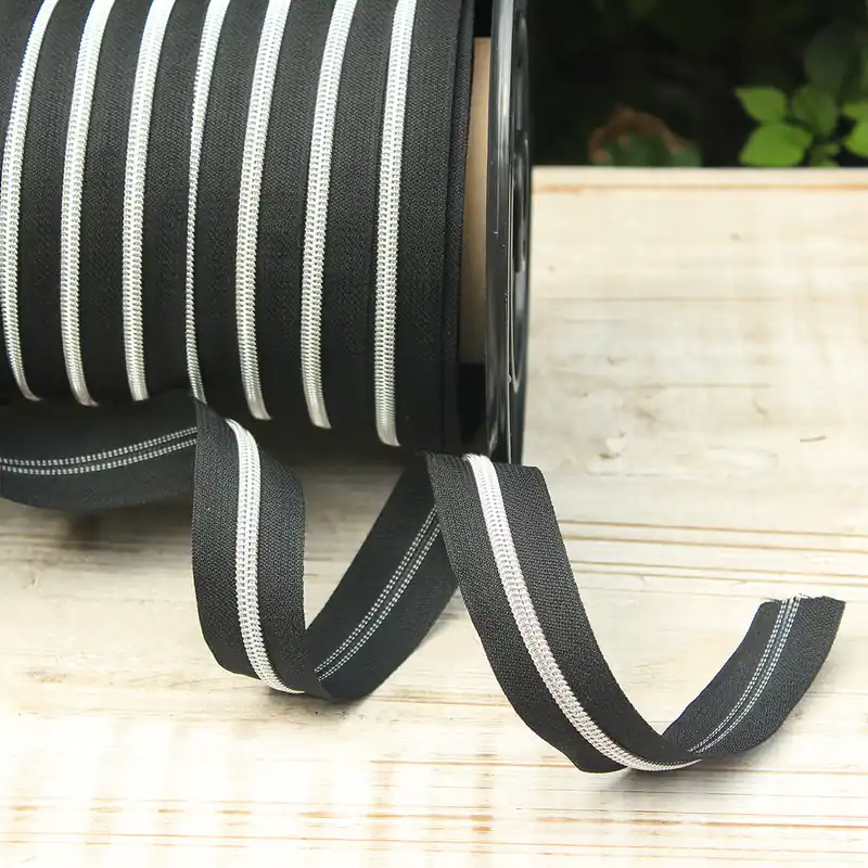 Reißverschluss metallisiert schwarz/silber breite Raupe Neue Kollektion