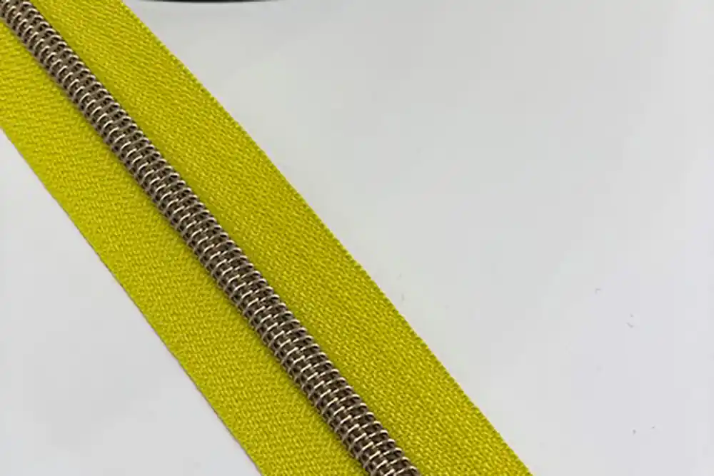 Sonderaktion Reißverschluss metallisiert breite Raupe limone/messing-antik