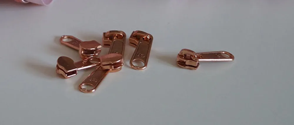 Bügelschieber für metallisierte Reißverschlussmeterware breit kupfer Original