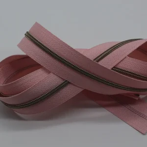 Reißverschluss metallisiert schmale Raupe rosé/messing-antik Aktuell