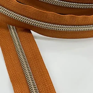 Reißverschluss metallisiert breite Raupe marone/messing-antik Ab Werk